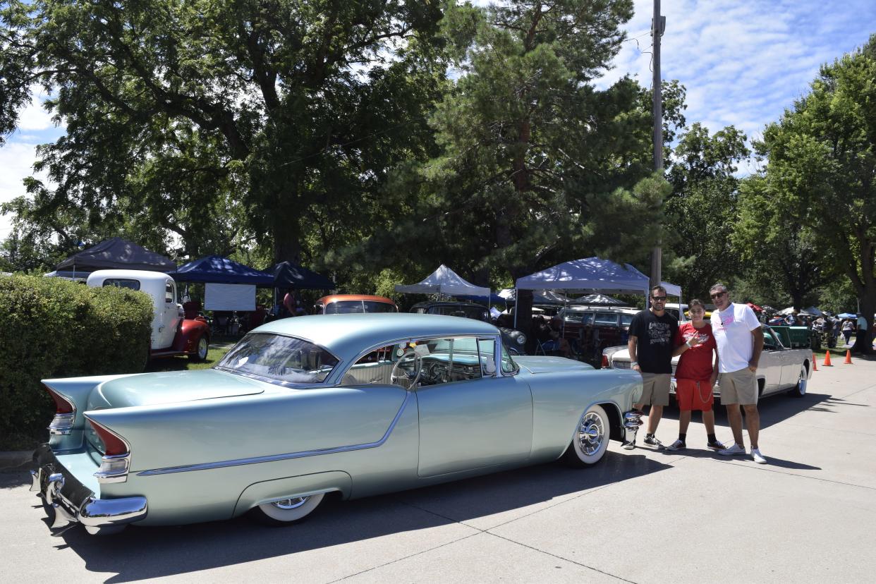 Jim Soumang, Enzo Dezzotti and Neil Dezzotti (left to right), pose with a 1954 Oldsmobile Super 88. The three came all the way from White Wall Garage in Santa Fe, Texas, to the Leadsled Spectacular
