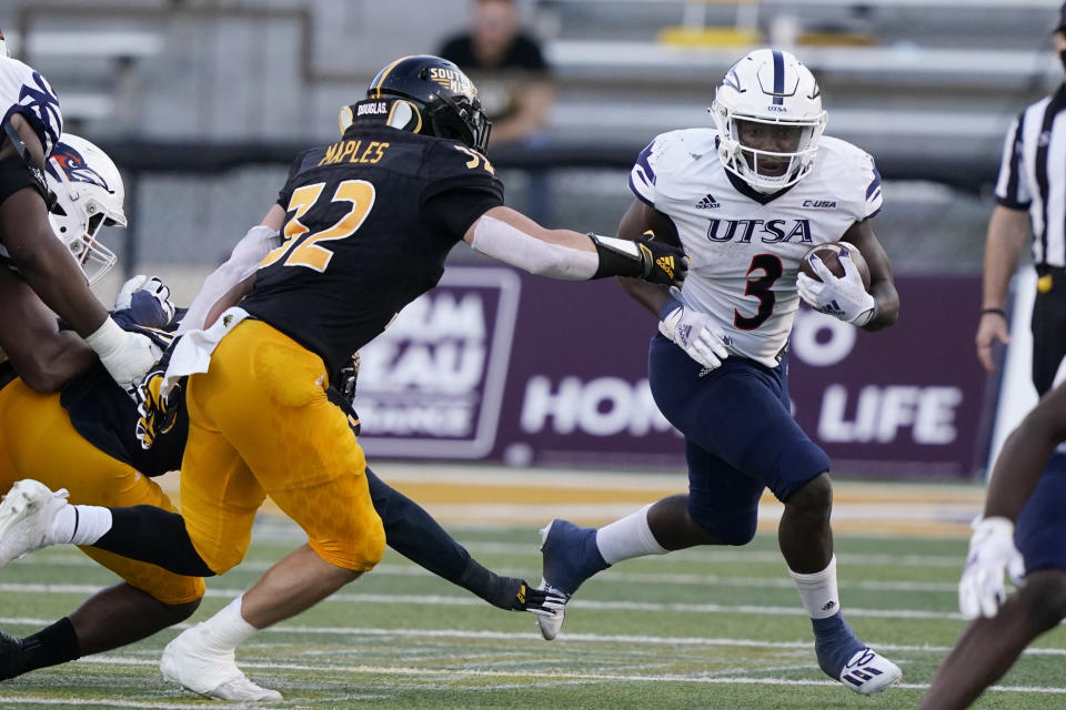 UTSA running back Sincere McCormick (3) runs past Southern Mississippi linebacker Hayes Maples (32) for a first down during the second half of an NCAA college football game, Saturday, Nov. 21, 2020, in Hattiesburg, Miss. UTSA won 23-20. (AP Photo/Rogelio V. Solis)