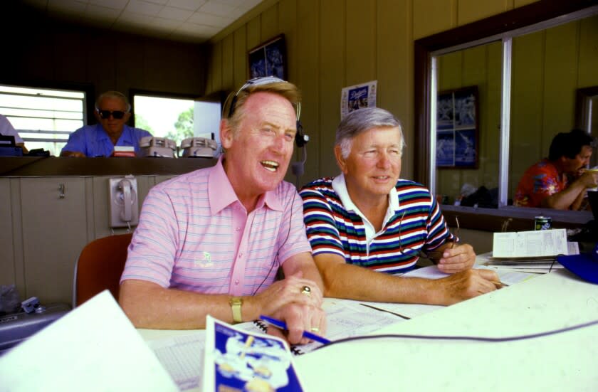 VERO BEACH, FLORIDA – APR. 8, 1985 ––Vin Scully with Jerry Doggett in the announcer's booth.