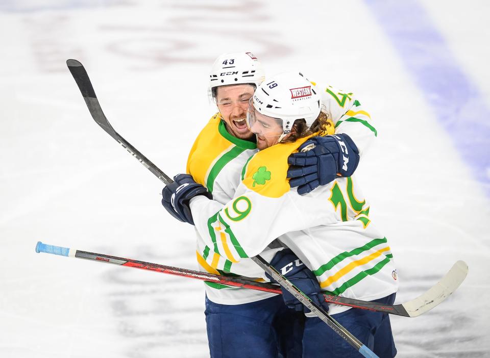 Admirals left wing John Leonard and defenseman Jordan Gross celebrate Gross’ goal (on Leonard's assist) against the Tucson Roadrunners. Years before playing professionally in Milwaukee, the two played junior hockey in Green Bay, although not at the same time.