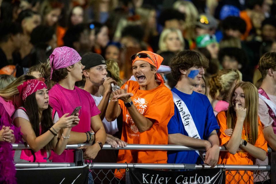 Liberty Lions watch the game from the bleachers at Liberty High School in Peoria on Oct. 13, 2023.