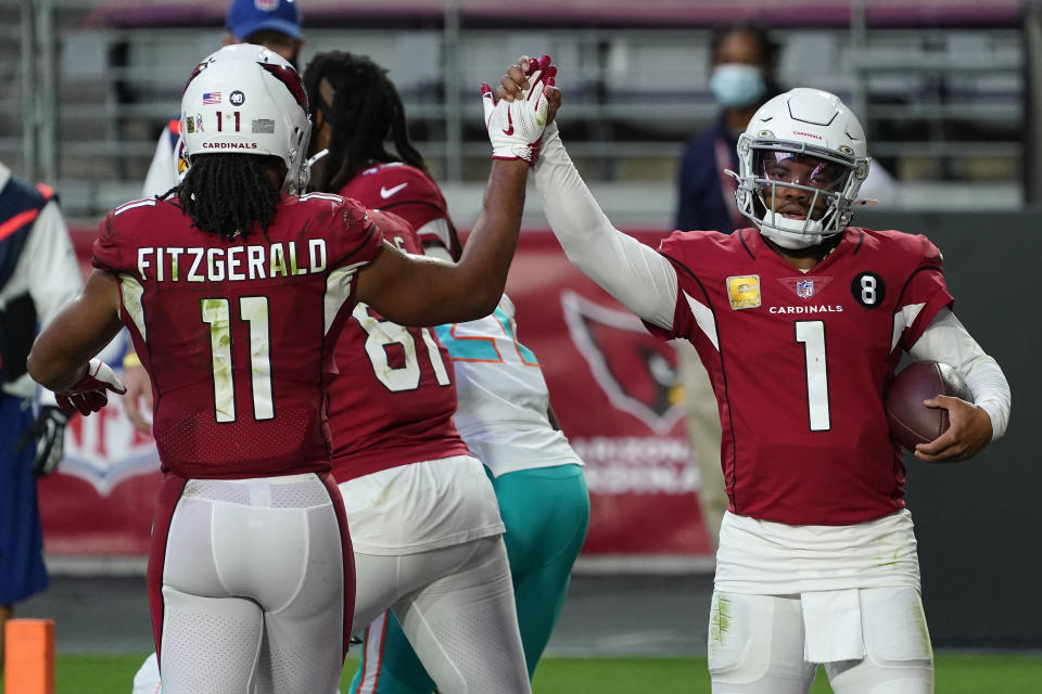 Arizona Cardinals quarterback Kyler Murray (1) high fives wide receiver Larry Fitzgerald (11) after scoring a touchdown against the Miami Dolphins during the second half of an NFL football game, Sunday, Nov. 8, 2020, in Glendale, Ariz. (AP Photo/Rick Scuteri)