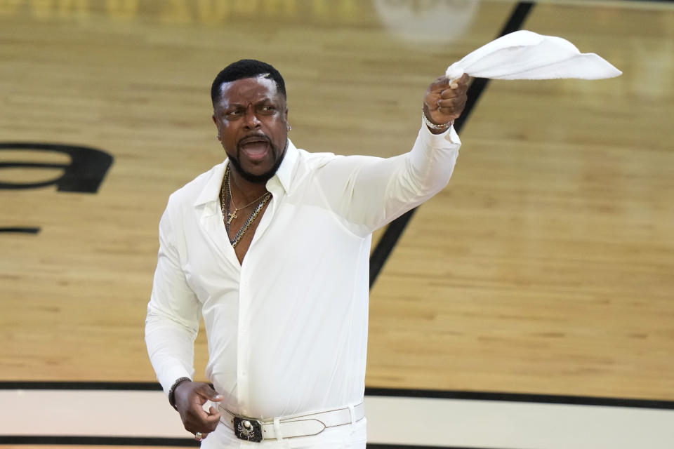 Actor Chris Tucker rallies the fans during the first half of Game 4 of the basketball NBA Finals between the Miami Heat and the Denver Nuggets, Friday, June 9, 2023, in Miami. (AP Photo/Lynne Sladky)