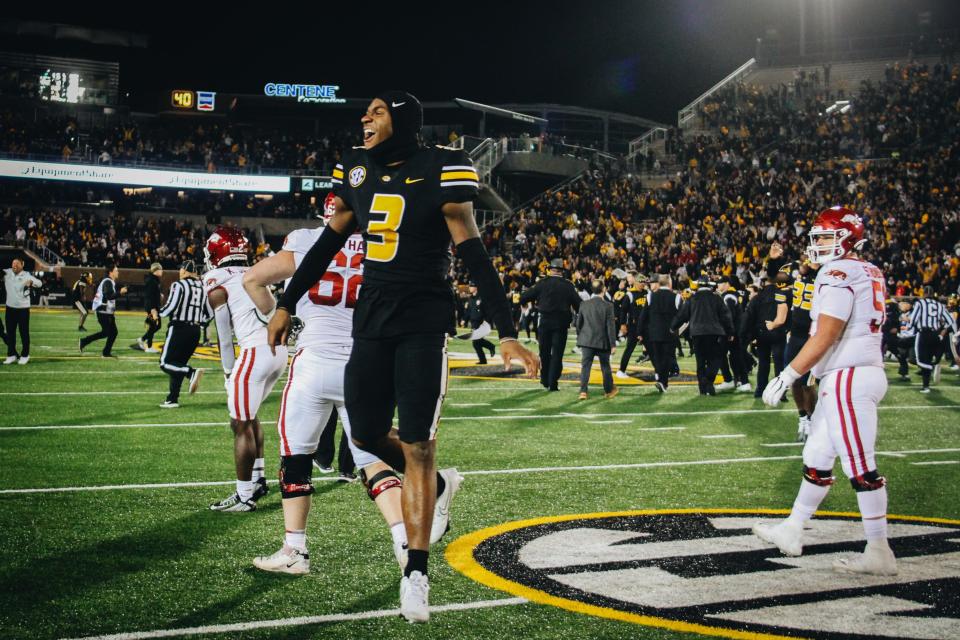 Missouri wide receiver Luther Burden (3) jumps around in celebration on Nov. 25, 2022, enjoying the Tigers' 29-27 win over Arkansas in Columbia, Mo.