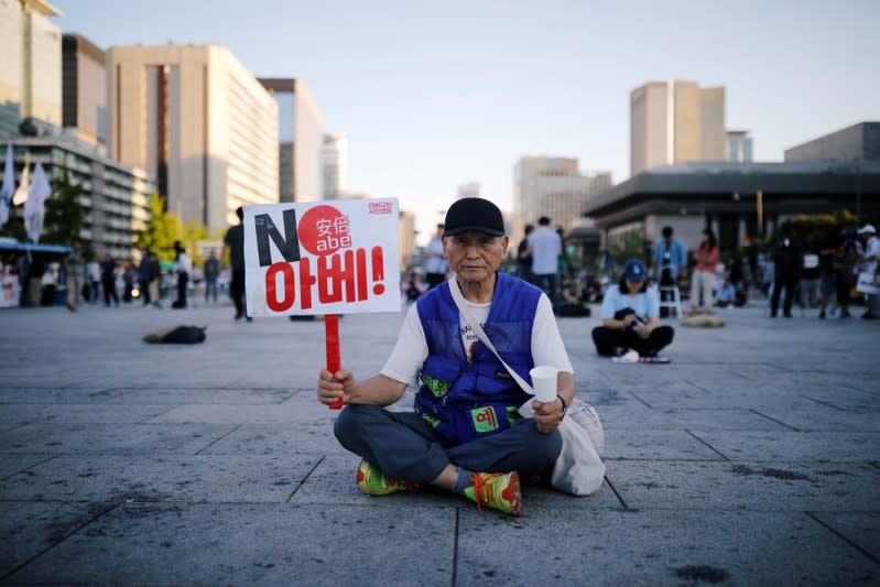 A man attends an anti-Japan rally in Seoul