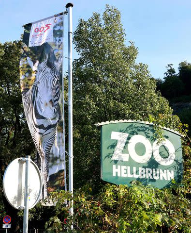 <p>FRANZ NEUMAYR/APA/AFP via Getty</p> Banners at the entrance of the Salzburg Zoo Hellbrunn on Sept. 12, 2023 in Salzburg, Austria, after a rhinoceros attacked and killed one zookeeper and severely injured another in its enclosure