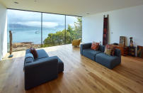 The huge window at the end of the main living space shows views across the water (Picture: Andrew Lee)