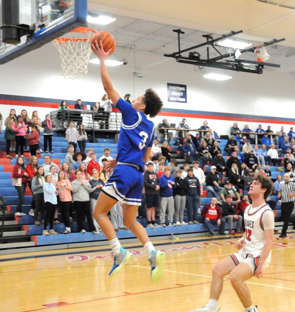 Cambridge junior Jesiah Barnett goes to the rim during the sectional final game at Indian Valley Saturday night.