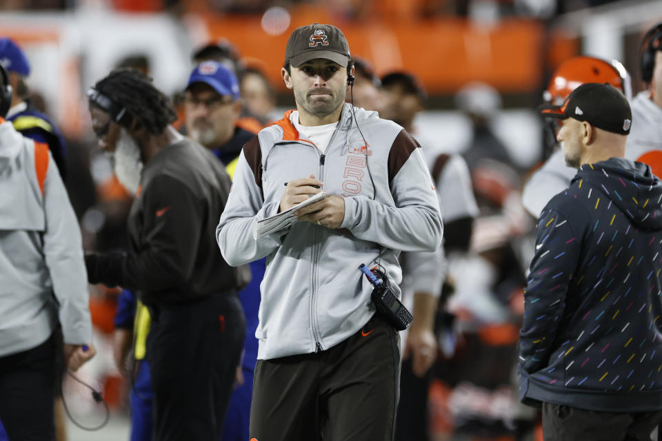 Cleveland Browns quarterback Baker Mayfield watches during the first half of the team's NFL football game against the Denver Broncos, Thursday, Oct. 21, 2021, in Cleveland. (AP Photo/Ron Schwane)