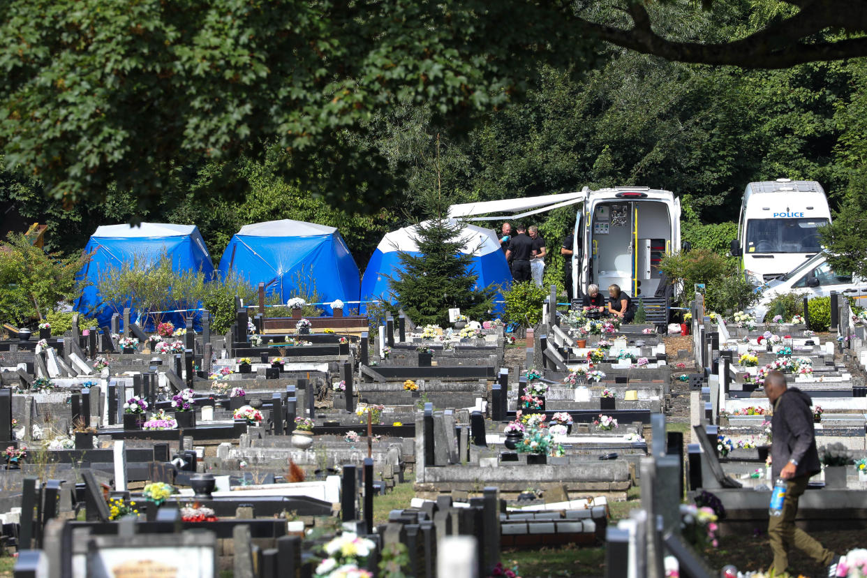 Police at the scene and forensic tents erected at Tipton Cemetery, in Sandwell, West Midlands. (swns)