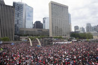 Fans pack Nathan Phillips Square at City Hall ahead of the 2019 Toronto Raptors NBA basketball championship parade in Toronto, Monday, June 17, 2019. (Photo by Andrew Lahodynskyj/The Canadian Press via AP)