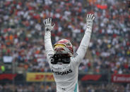 Mercedes driver Lewis Hamilton, of Britain, celebrates after his victory in the Formula One Mexico Grand Prix auto race at the Hermanos Rodriguez racetrack in Mexico City, Sunday, Oct. 27, 2019. (AP Photo/Eduardo Verdugo)