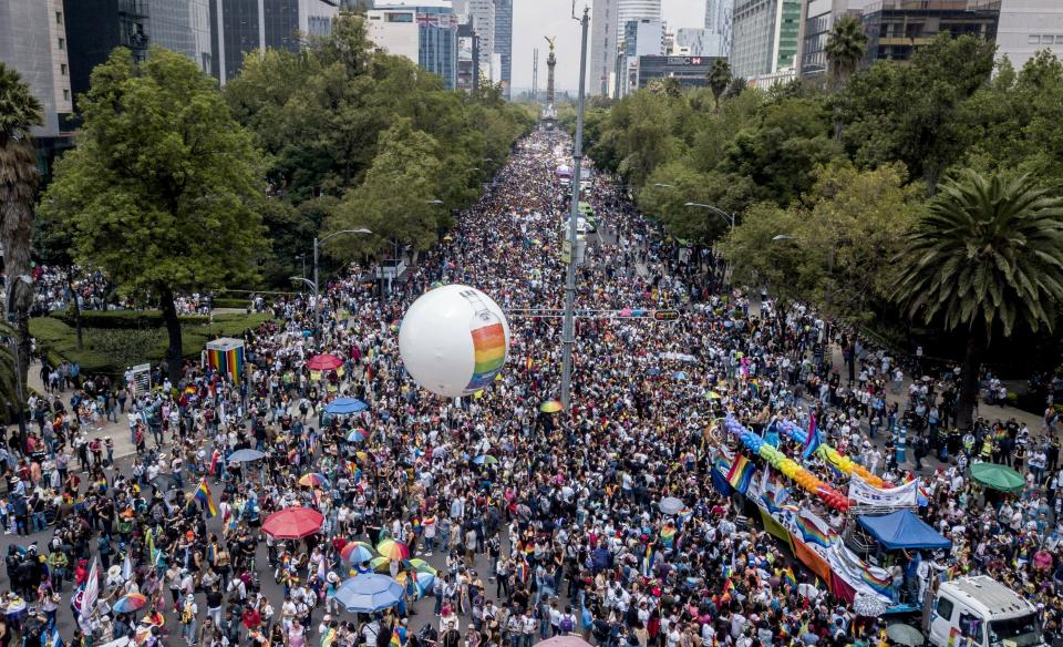Revelers fill Mexico City's iconic Reforma Avenue during the gay pride parade, Saturday, Jun. 29, 2019. (AP Photo/Christian Palma)