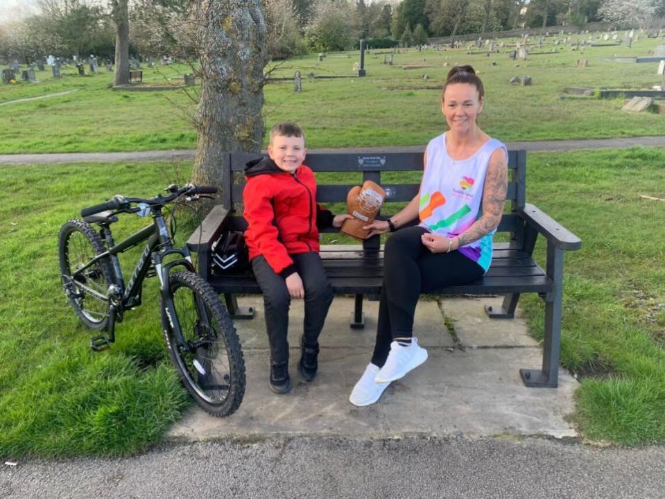 The Northern Echo: Donna with son Adam, now eight, and the golden glove she won for being top fundraiser at Ryan's memorial bench.