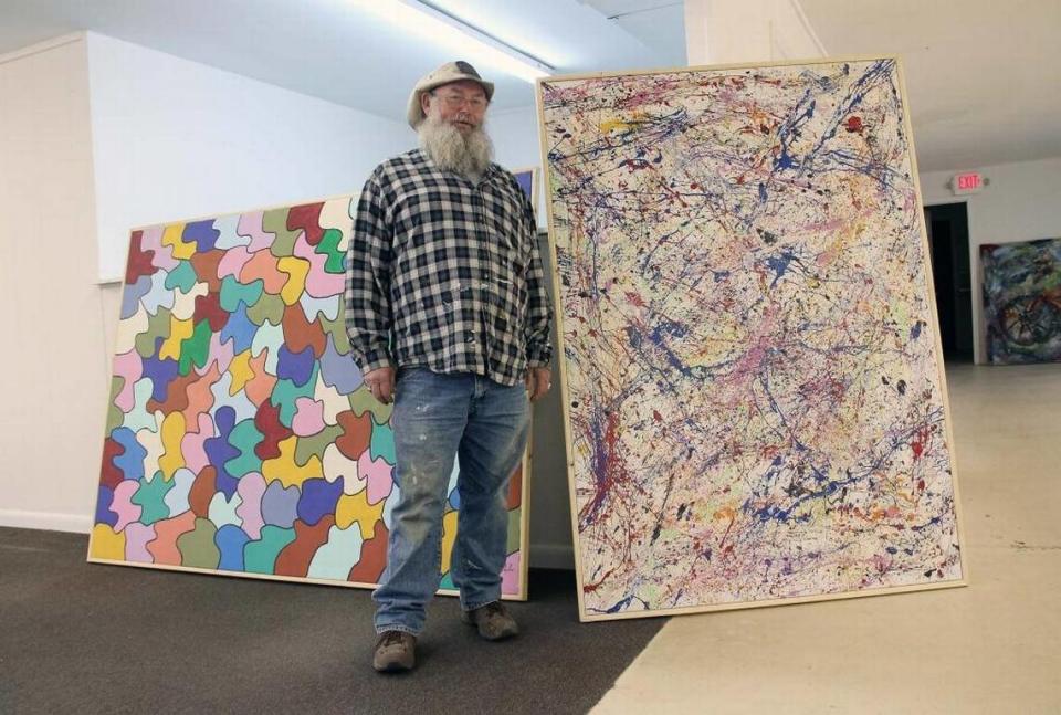 Sam Ezell with some of his artwork.