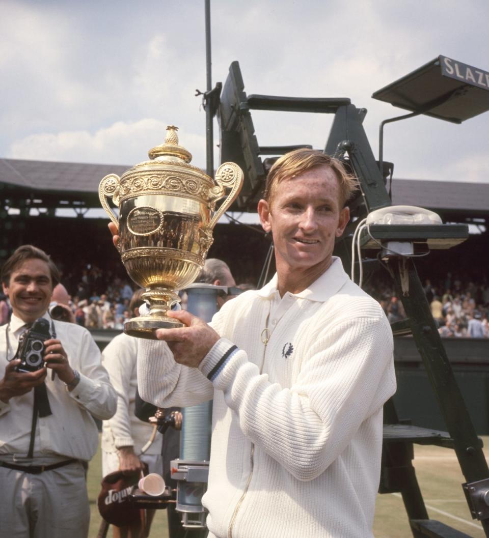 Rod Laver marks his return to Wimbledon with the trophy (PA) (PA Archive)