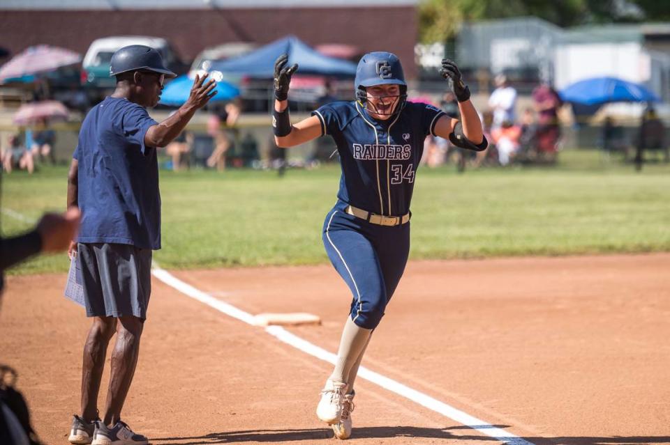 Central Catholic Raiders pitcher Randi Roelling (34) celebrates after her first inning home run against the Ponderosa Bruins, and is congratulated by head coach Sam Nichols, at the CIF Northern California Division III softball championship game Saturday, June 3, 2023, at Ponderosa High School in Shingle Springs.