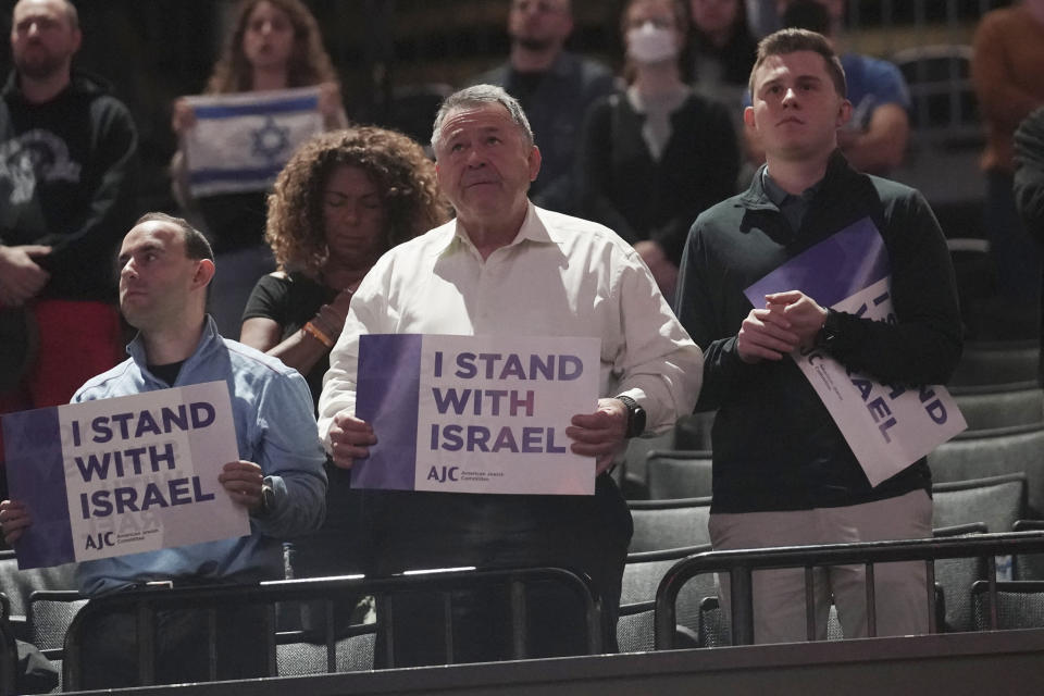 Fans show support for Israel as they stand during the nation anthem before a preseason NBA basketball game between Israel's Maccabi Ra'anana the Brooklyn Nets, Thursday, Oct. 12, 2023, in New York. (AP Photo/Bebeto Matthews)