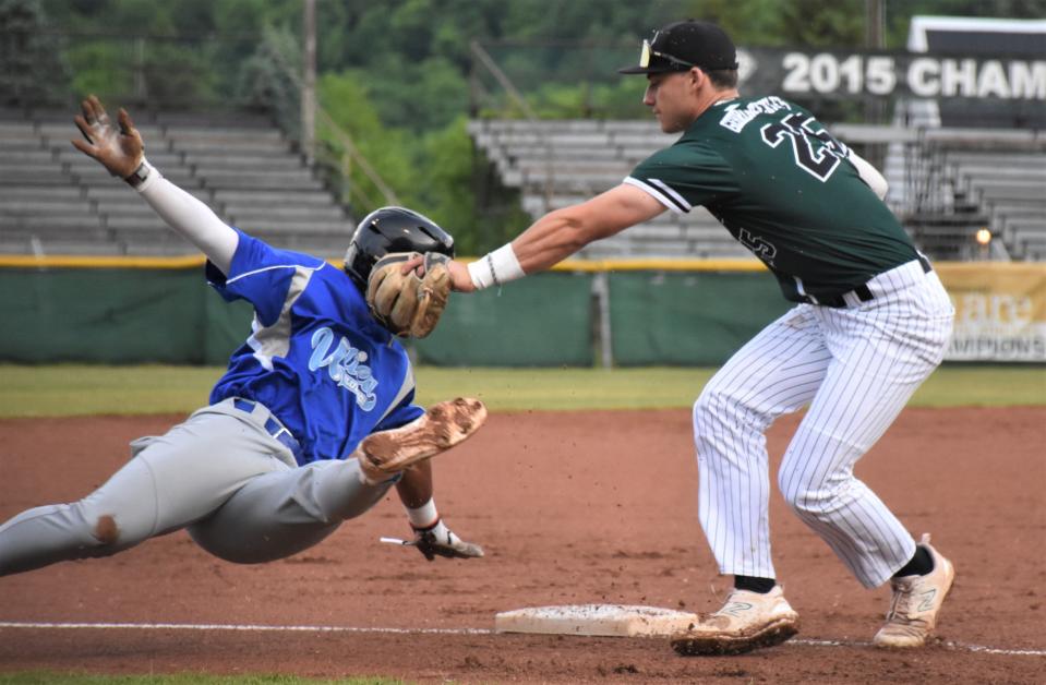 Mohawk Valley DiamondDawgs shortstop Justin Hackett (right) tags out Pablo Santos of the Utica Blue Sox after Santos overran third base during the first inning Thursday at Veterans Memorial Park.