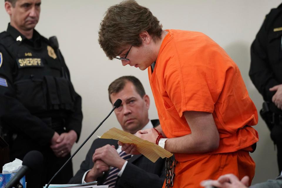 Gunman Payton Gendron reads an apology to the court at sentencing for charges, including murder and domestic terrorism motivated by hate, before Erie County Court Judge Susan Eagan, Wednesday, Feb. 15, 2023, in Buffalo, N.Y. Gendron, a white supremacist who killed 10 Black people at a Buffalo supermarket has been sentenced to life in prison without parole Wednesday after listening to the relatives of his victims express the pain and rage caused by his racist attack. (Derek Gee/The Buffalo News via AP, Pool) ORG XMIT: NYBUE802