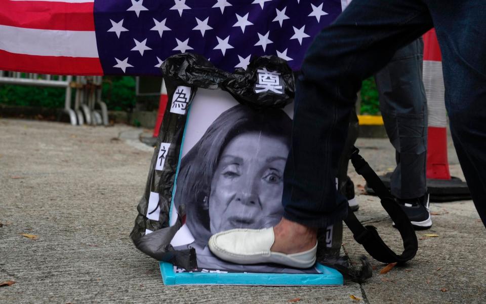 Nancy Pelosi - AP Photo/Kin Cheung