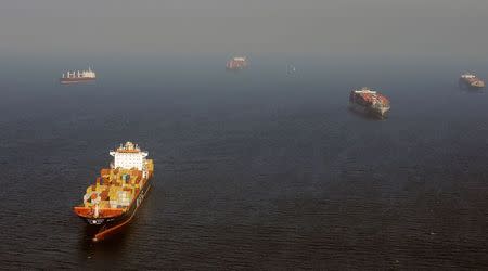 Ships gather off the ports of Los Angeles and Long Beach, California in this aerial file photo taken February 6, 2015. REUTERS/Bob Riha, Jr.