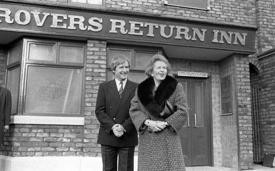 William Roache and Margaret Thatcher on the set of Coronation Street in 1990 - PA