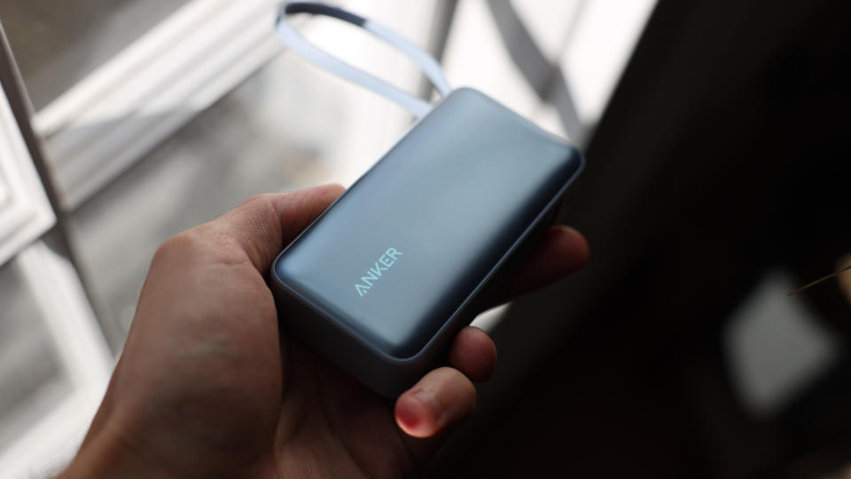 Anker Nano 30W Power Bank in a hand in sunlight