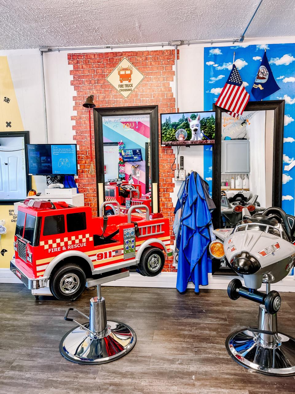A fire truck and fighter jet are just two of the vehicles children can sit in at Brave Little Clippers in Fountain City on Aug. 3, 2022.