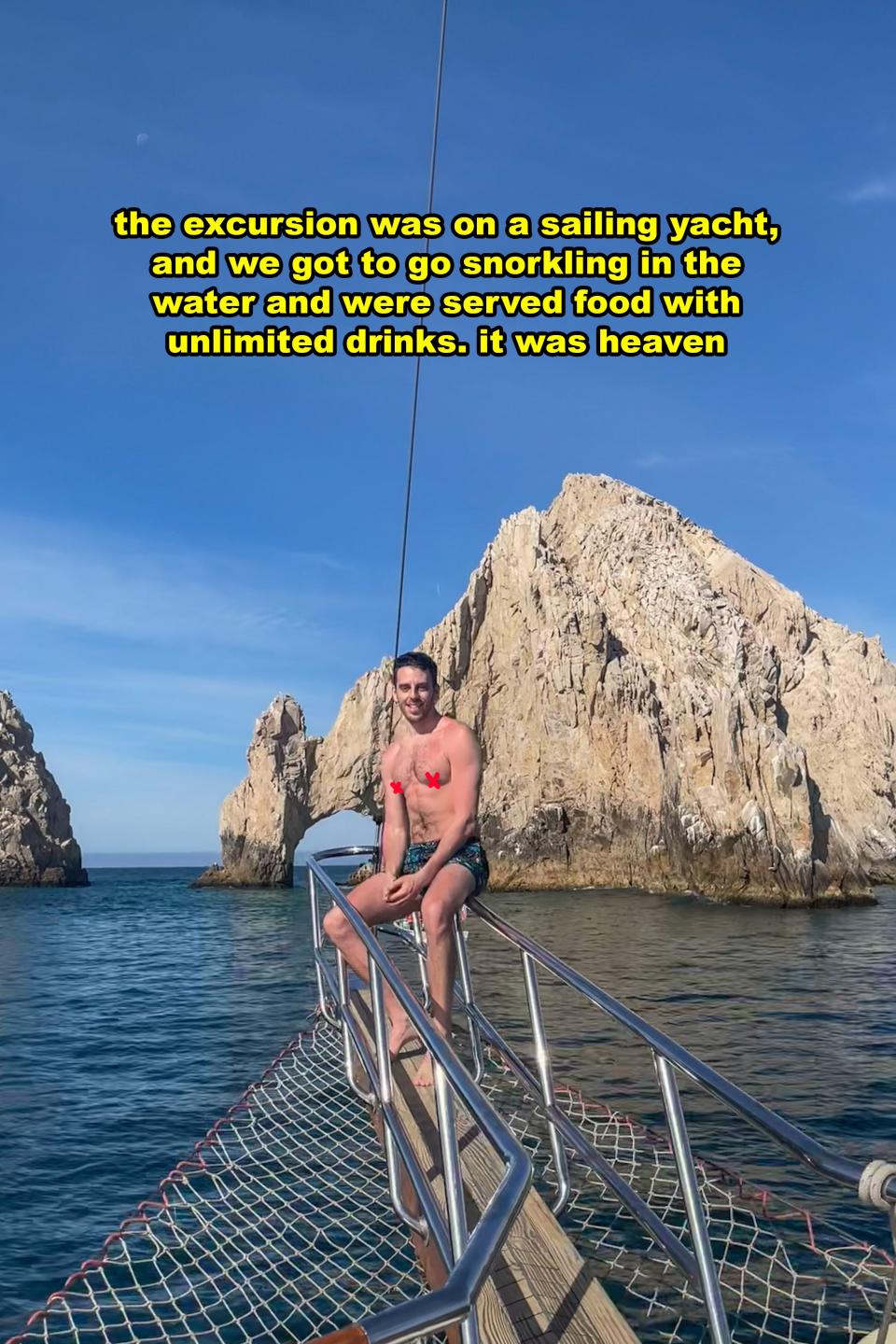 Person sitting on a yacht's bow with rocky formations in the background. Text recounts enjoyable sailing and snorkeling experience