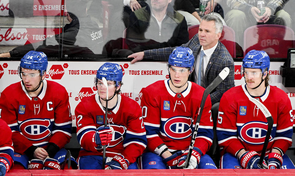 Montreal Canadiens coach Martin St. Louis watches from the bench during the third period of the team's NHL hockey game against the Ottawa Senators in Montreal, Tuesday, Jan. 23, 2024. (Graham Hughes/The Canadian Press via AP)