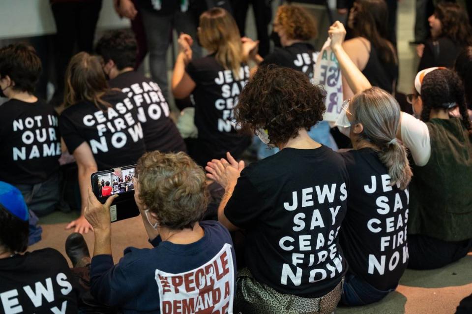 Members of Jewish Voice for Peace Action show support for a cease-fire in the Gaza Strip during a sit-in protest at the California Democratic Party state endorsement convention on Saturday at SAFE Credit Union Convention Center in Sacramento.