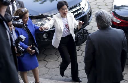 World Health Organization (WHO) Director-General Margaret Chan (C) greets Oswaldo Cruz Foundation President Paulo Gadelha during a visit to the Oswaldo Cruz Foundation in Rio de Janeiro, Brazil, February 24, 2016. REUTERS/Ricardo Moraes