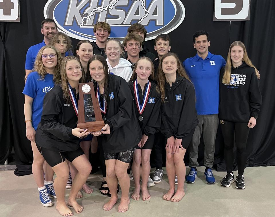 Highlands Bluebirds pose with their second-place trophy in the combined team standings during the KHSAA state girls swimming championships Feb. 24, 2024 at the University of Kentucky's Lancaster Aquatic Center.