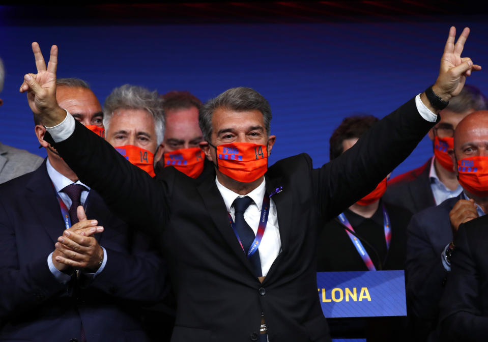 Joan Laporta celebrates his victory after elections at the Camp Nou stadium in Barcelona, Spain, Sunday, March 7, 2021. Joan Laporta has been elected Barcelona's president on Sunday, inheriting a club mired in debt and facing daunting problems that include the possible departure of Messi when his contract ends at the end of the season. (AP Photo/Joan Monfort)