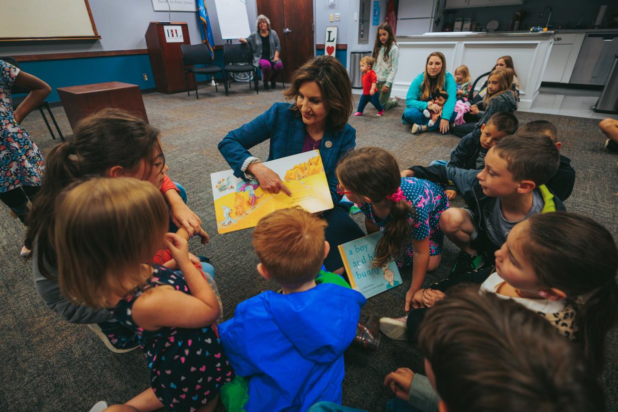 State schools Superintendent Joy Hofmeister, a gubernatorial candidate, reads books to children and answers parents' questions on the issues at the Bartlesville Public Library on Wednesday during her "Hometown Tour."