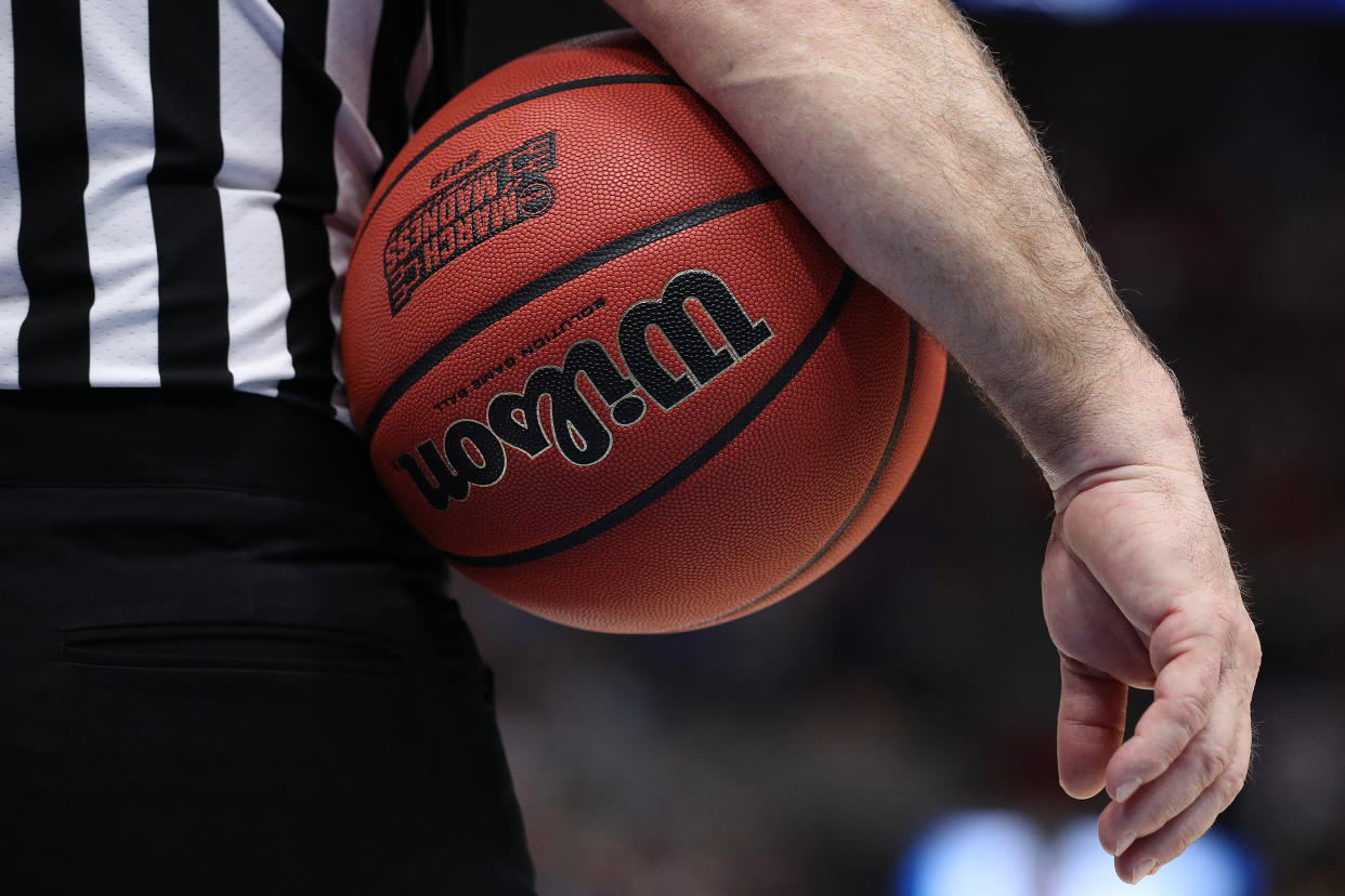 SALT LAKE CITY, UTAH - MARCH 23: An official holds the ball during the game between the Gonzaga Bulldogs and the Baylor Bears in the Second Round of the NCAA Basketball Tournament at Vivint Smart Home Arena on March 23, 2019 in Salt Lake City, Utah. (Photo by Patrick Smith/Getty Images)