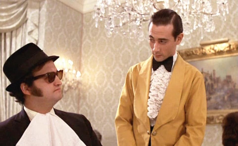 John Belushi looking at Paul Reubens