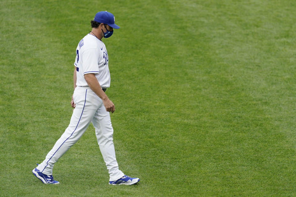 Kansas City Royals manager Mike Matheny walks to the dugout after making a pitching change during the first inning of a baseball game against the Chicago White Sox Saturday, May 8, 2021, in Kansas City, Mo. (AP Photo/Charlie Riedel)