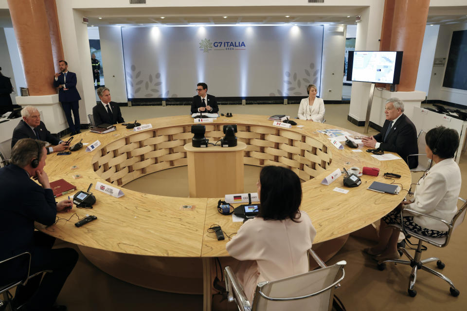 British Foreign Secretary David Cameron, down left, European Union foreign policy chief Josep Borrell, left, U.S. Secretary of State Antony Blinken, top left, German Foreign Minister Annalena Baerbock, bottom, Japanese Foreign Minister Yoko Kamikawa, right, Canadian Minister of Foreign Affairs Melanie Joly, top right, French Foreign Minister Stephane Sejourne, top, and Italian Foreign Minister Antonio Tajani meet on the second day of a G7 foreign ministers meeting on Capri island, Italy, Thursday April 18, 2024. (Remo Casilli/Pool via AP)