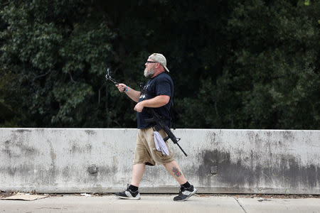 Greg Holland, a member of Open Carry Texas, openly carries a firearm in Houston, Texas, U.S., September 24, 2018. Picture taken September 24, 2018. REUTERS/Loren Elliott