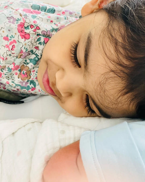 Siti's daughter Aafiyah with her new baby brother