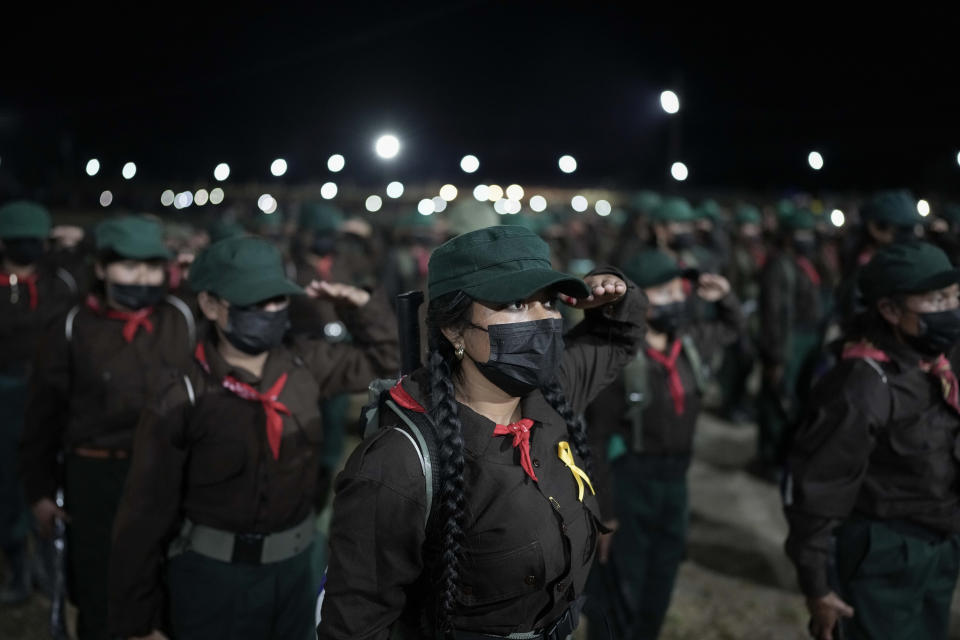 Members of the Zapatista National Liberation Army, EZLN, attend an event marking the 30th anniversary of the Zapatista uprising in Dolores Hidalgo, Chiapas, Mexico, Sunday, Dec. 31, 2023. (AP Photo/Eduardo Verdugo)