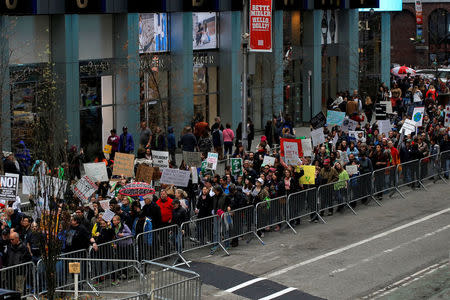 People line Broadway during the Earth Day 'March For Science NYC' demonstration to coincide with similar marches globally in Manhattan, New York, U.S., April 22, 2017. REUTERS/Andrew Kelly