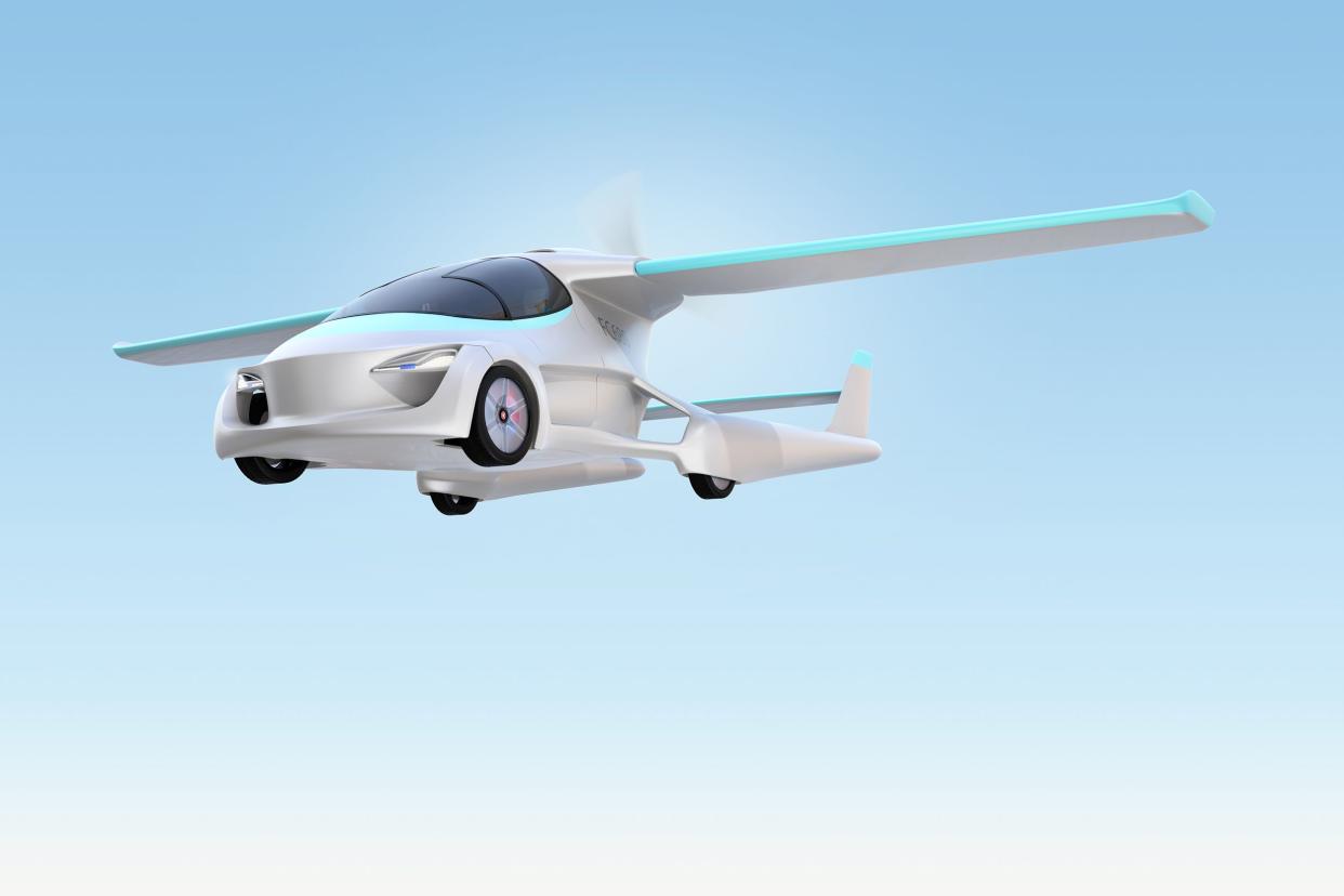 futuristic autonomous car flying in the sky