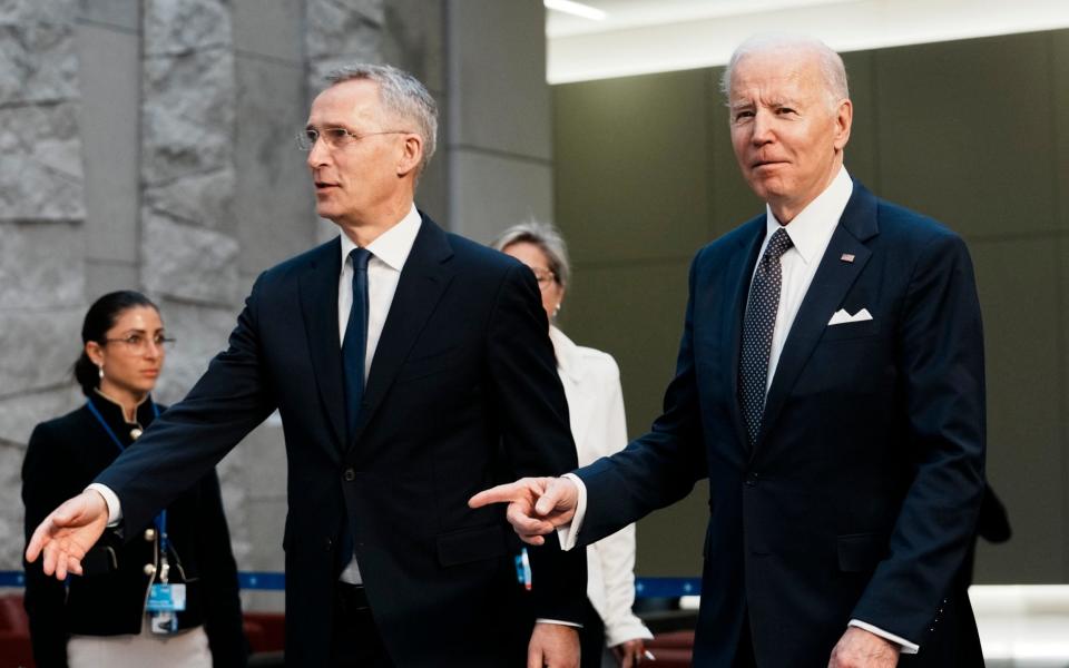 US president Joe Biden, right, walks with Nato Secretary General Jens Stoltenberg at the summit  - AP Photo/Thibault Camus