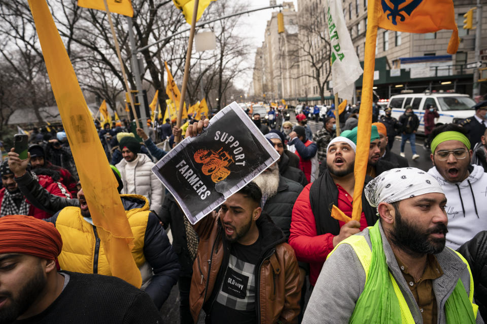 Protesters lead a chant while gathering on Fifth Avenue outside the Consulate General of India, Tuesday, Jan. 26, 2021, in the Manhattan borough of New York. Tens of thousands of protesting farmers have marched, rode horses and drove long lines of tractors into India's capital, breaking through police barricades to storm the historic Red Fort. The farmers have been demanding the withdrawal of new laws that they say will favor large corporate farms and devastate the earnings of smaller scale farmers. Republic Day marks the anniversary of the adoption of India’s constitution on Jan. 26, 1950. (AP Photo/John Minchillo)