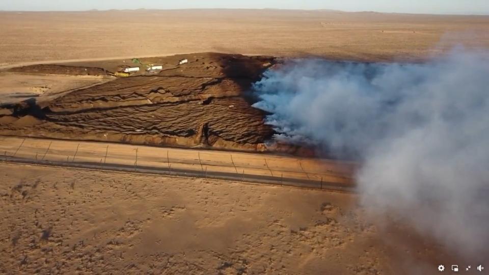 Barstow resident Robert Hall captured an overhead view of a massive solid-waste fire around a week after it erupted in an 80-acre pit of sewage sludge and green waste operated by Synagro Technologies Inc. at a controversial High Desert facility.