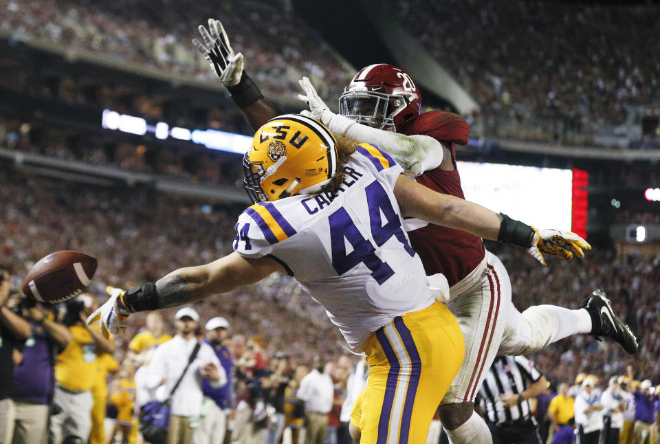 LSU fullback Tory Carter misses a pass as Alabama linebacker Shaun Dion Hamilton defends during the first half of an NCAA college football game, Saturday, Nov. 4, 2017, in Tuscaloosa, Ala. (AP Photo/Brynn Anderson)