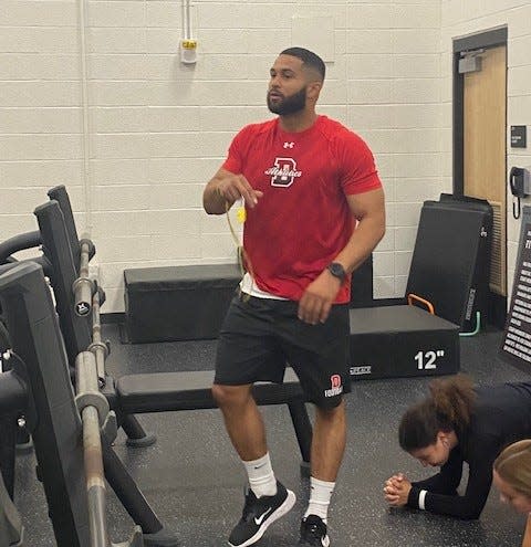 Durfee strength and conditioning coach Cabrinni Goncalves watches workouts inside the fitness center.